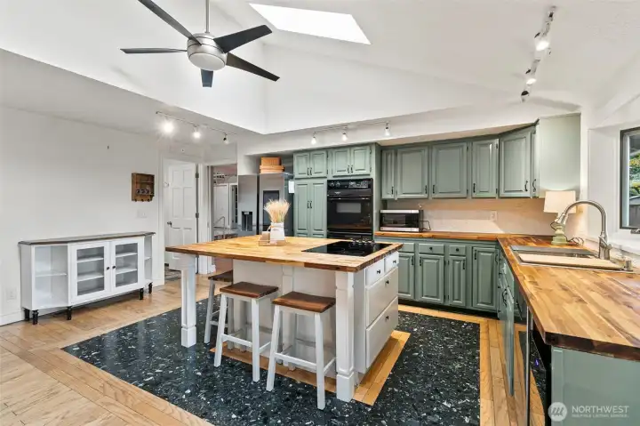 Updated kitchen with updated appliances.  Double ovens, beautiful refrigerator, wine rerigerator.