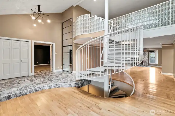 This staircase goes up to a loft area and 2 bedrooms.  It goes down to a partially finished basement.