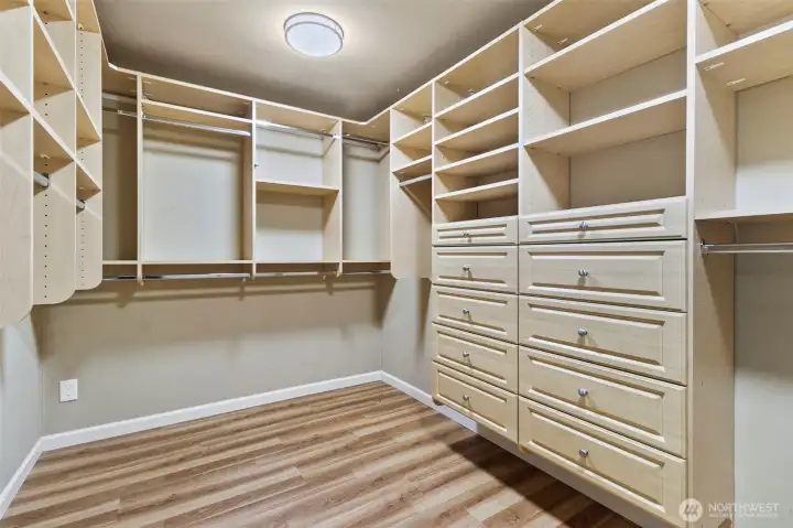 Primary closet with wonderfully appointed built-ins.