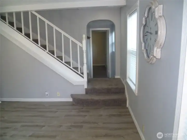 Living room leading to main floor bedroom