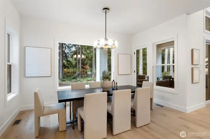 The large windows bring the outdoors, in.