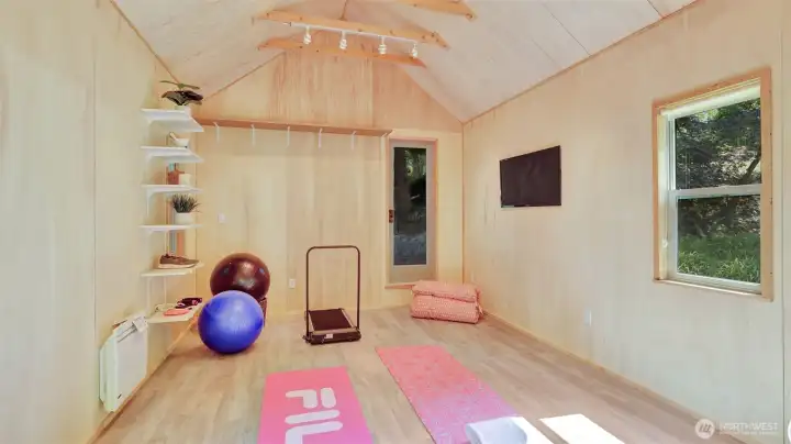 This adaptable flex space—once a pottery studio and now showcased as a yoga studio—offers endless possibilities for work, wellness, or creativity