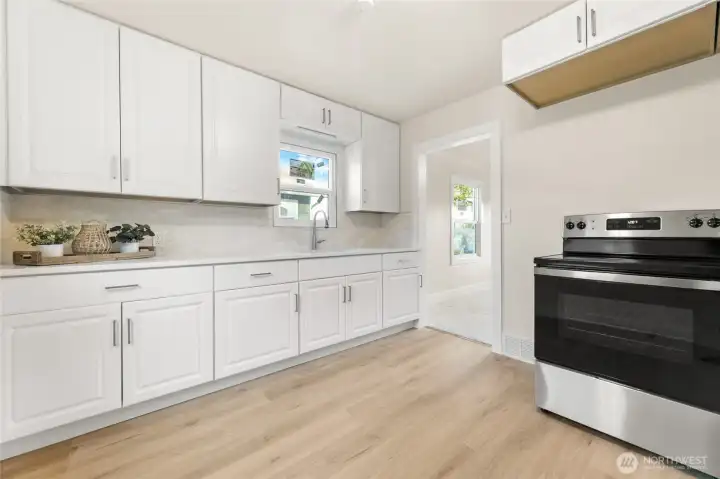 Kitchen with newer refrigerator, stove and new microwave (not shown)