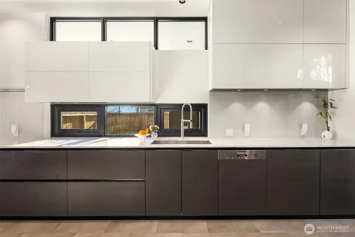 36" induction cooktop with 5 cooking zones, designer vent hood with led lighting, pot filler at cooktop & deep dual sink make prep a breeze