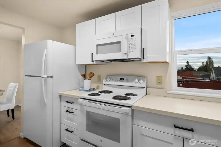 Kitchen view into the dining room.  All appliances stay!