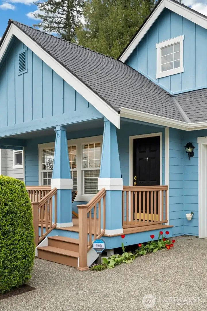 A welcoming front porch made for quiet mornings, slow coffee, and peaceful starts to the day. Great and easy to maintain decking materials!