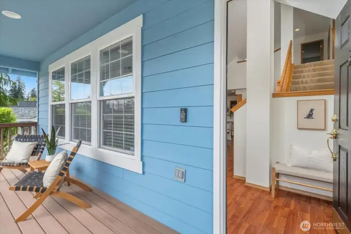 Covered porch for enjoying beverages throughout all seasons! Double-height entry and updated flooring throughout the home is a wow!