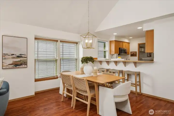 A light-filled dining area with easy access to the kitchen and breakfast bar, ideal for both casual meals and entertaining.