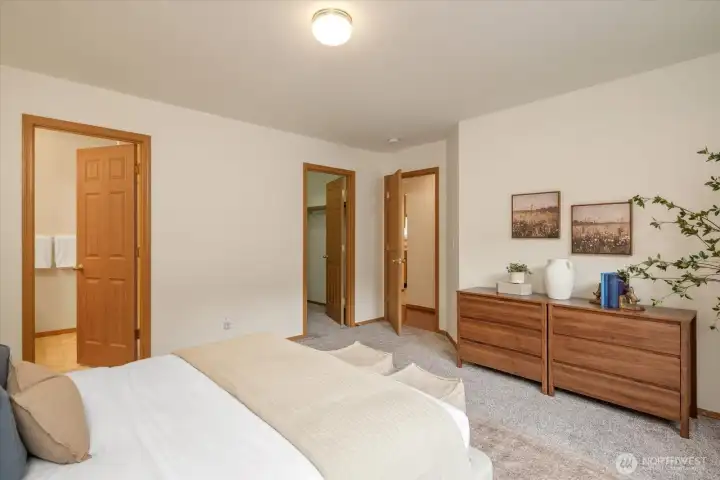 A thoughtfully arranged primary suite offering seamless access to the ensuite bath and walk-in closet.