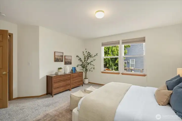 Large windows bring in natural light, enhancing the calm and airy feel of this private retreat.