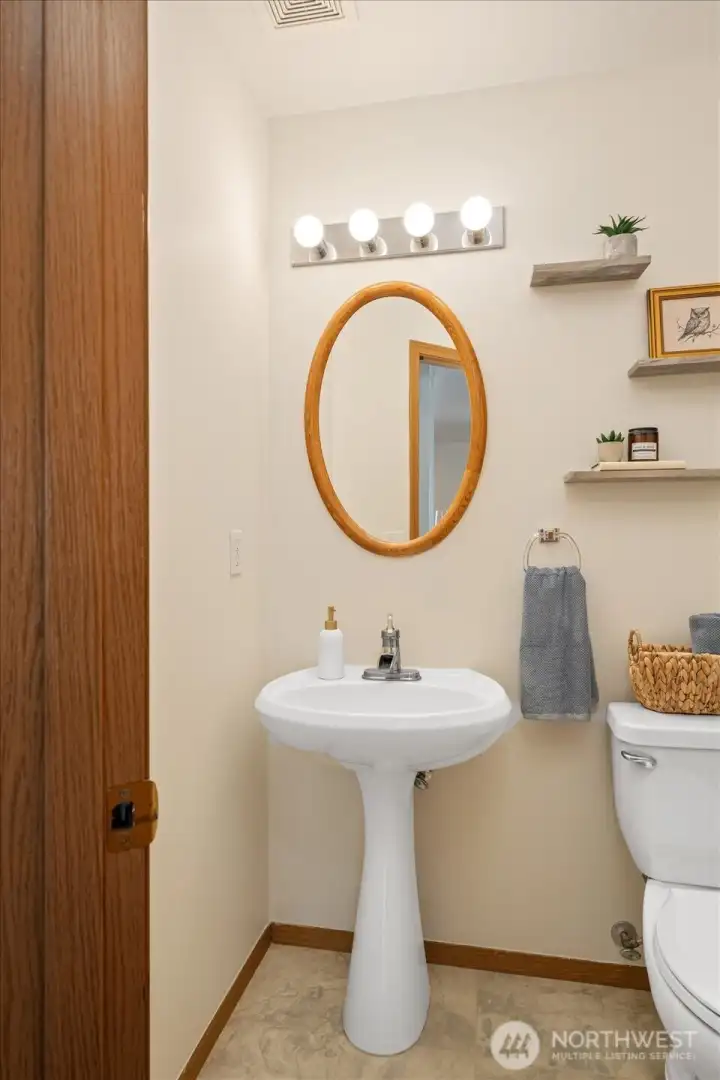 Powder room conveniently located for guests and everyday use.
