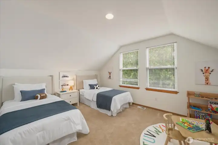 A secluded third bedroom paired with a nearby full bathroom, offering privacy for family or guests.