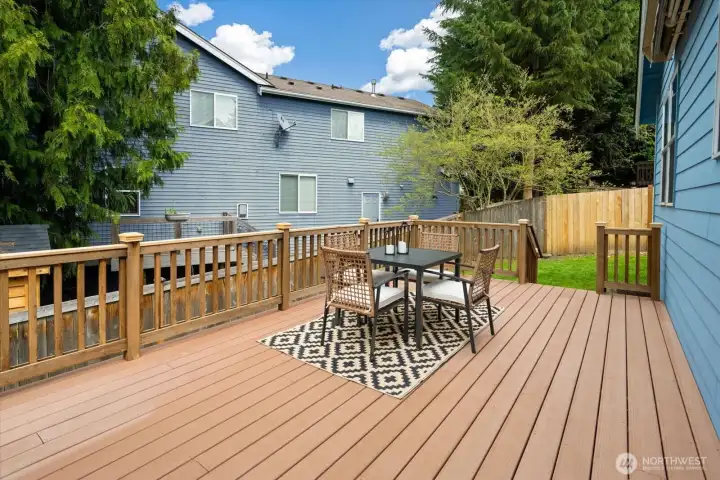 Expansive composite deck offering low-maintenance outdoor living for BBQs, gatherings and everyday enjoyment!
