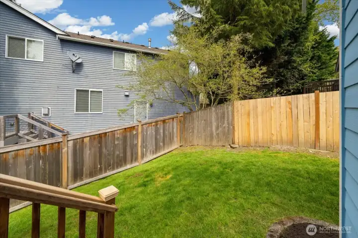 Fully fenced backyard offering privacy and room to enjoy.