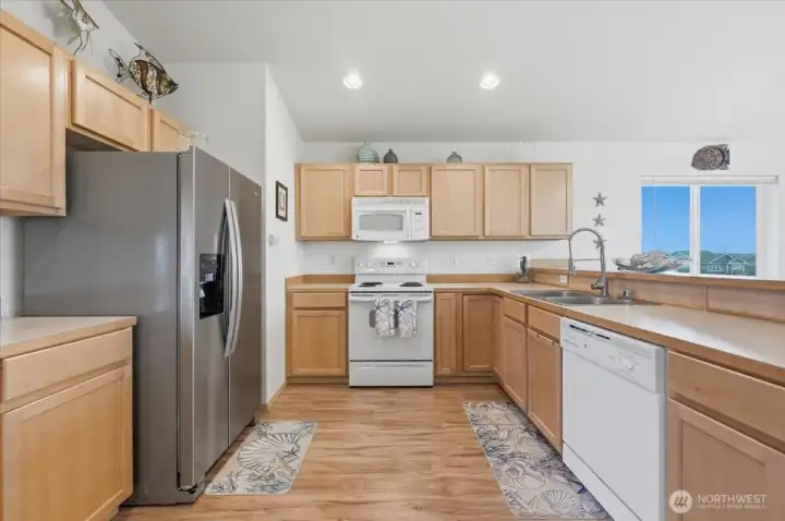 Come see how nice this home is!  Look at all that counterspace in these maple light colored cabinets~