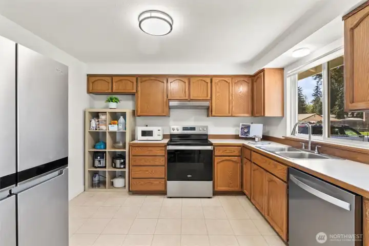 L-shaped kitchen with stainless steel appliances