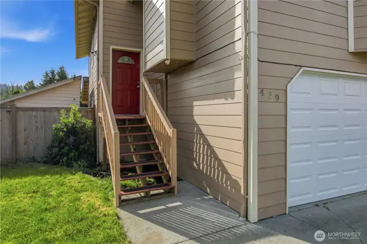 Entrance with 2 car garage .