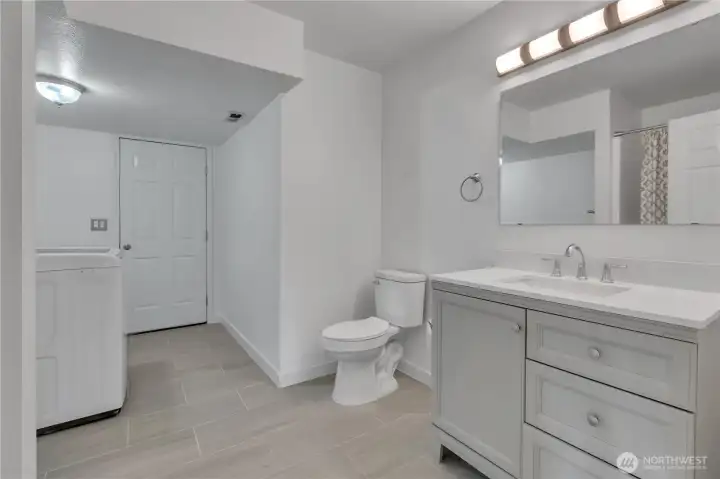3/4 bath with full size washer and dryer.