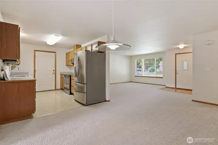 Galley kitchen with access door to the Garage.