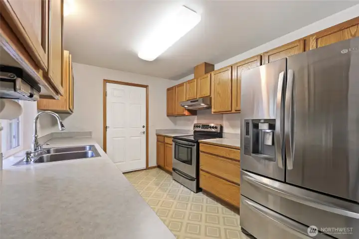Closer look at the Kitchen from the Sliding Glass Door to the Covered Porch.