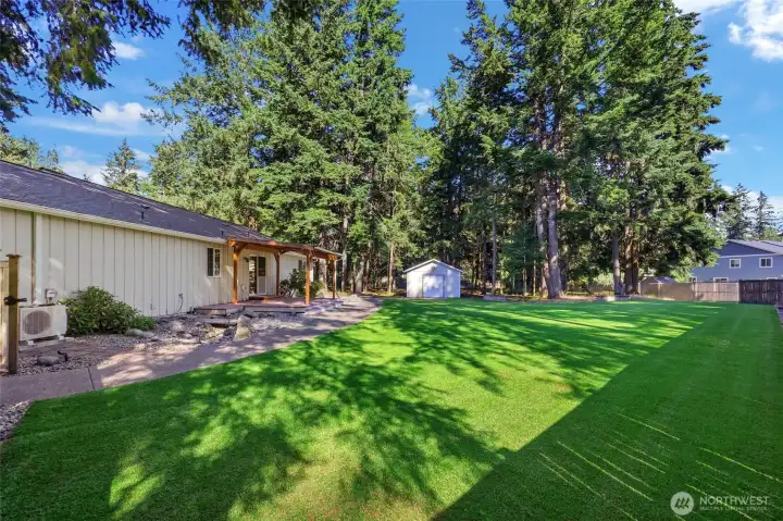 Walkways to the Shop from the Front and Side of the House. Mini Split showing. Fully Fenced Yard.