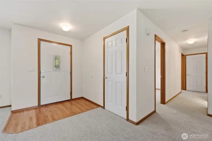 Hall near the Front Entry- Second and Third Bedroomsa re on the Left- Primary is on the right.