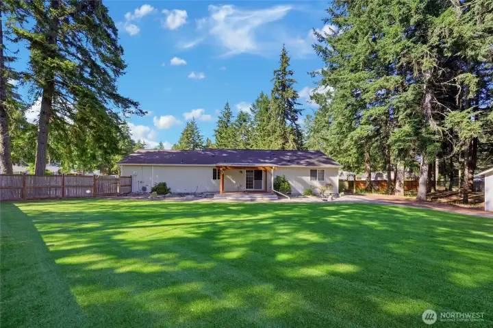 Large Fully Fenced Backyard - lots of room for relaxing or playing yard games.