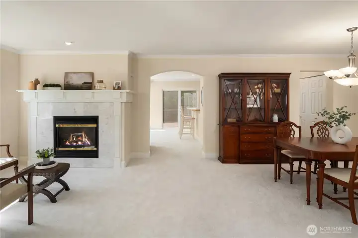 A cozy sitting area flows seamlessly into the spacious dining room, creating the perfect space for both everyday living and entertaining.