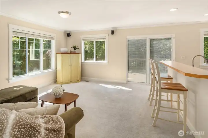 The living room is adjacent to the backyard, creating a seamless connection to outdoor living.