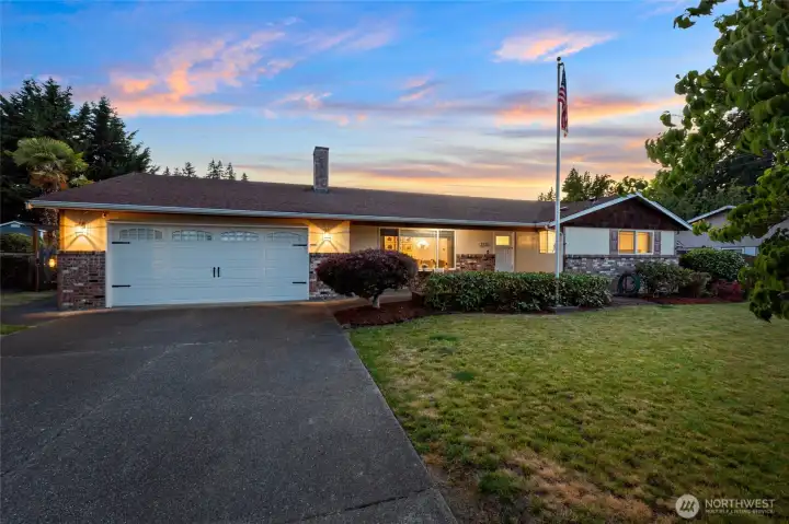 Welcome to this lovingly updated rambler nestled on a quarter acre fenced lot with a park-like setting. There's even a large flag pole with spotlight