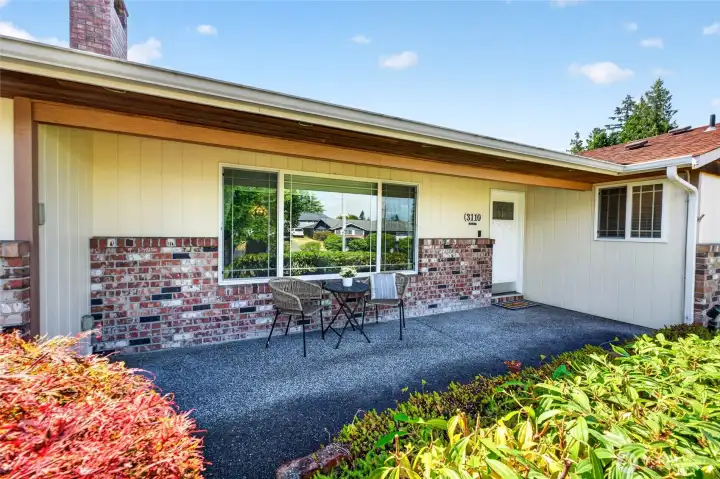 A charming covered porch welcomes you and the front door with glass window is beautiful
