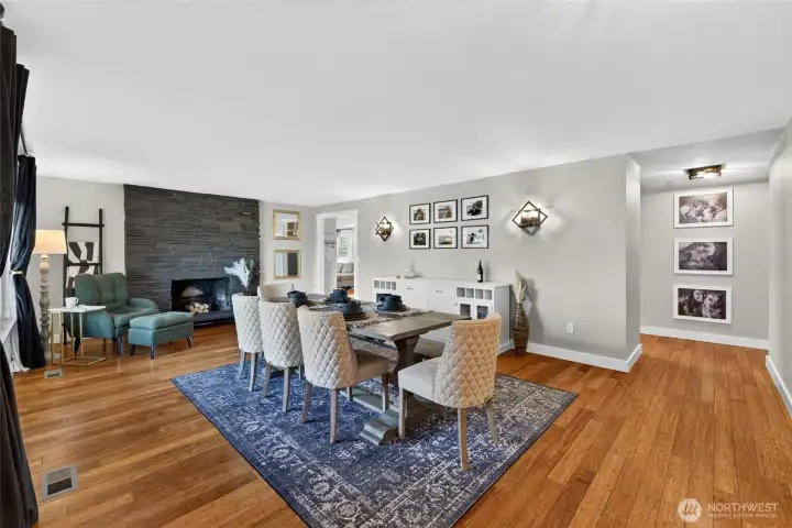 The living/dining/flex room offers a multitude of uses and is perfect for entertaining or relaxing by the fire with a good book