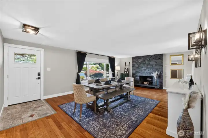 Unique stone flooring greets you in the entry and hardwood floors expand through most of the home. The home features all new faux wood blinds with the exception of this room, which features handy top-down bottom up blinds on the large picture window