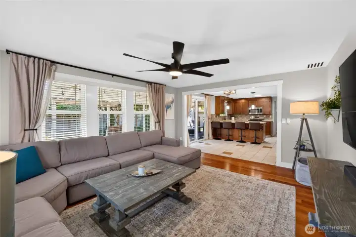The large family room also offers gleaming hardwood floors and beautifully trimmed windows. Most rooms in the house have new decorative fan lights