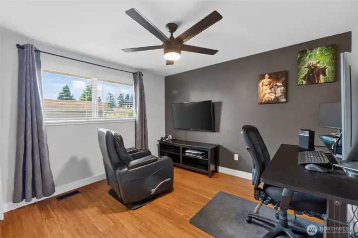 Another roomy bedroom with hardwood flooring. This zero carpet home is ideal for folks with allergies or pets. Simply add decorative rugs if you like