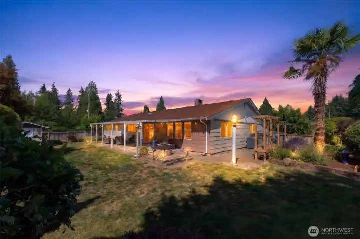 The back yard is a true oasis and the generous covered patio offers dining & relaxation options rain or shine