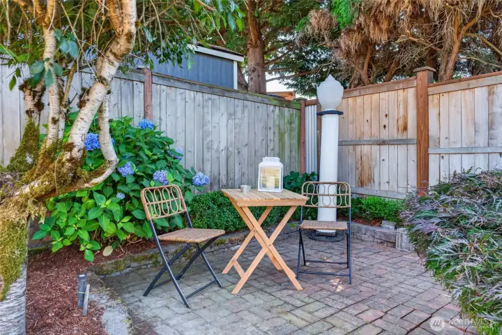 Tucked away spaces and iconic, period piece Puyallup city lights add a fun vibe to the fully fenced yard