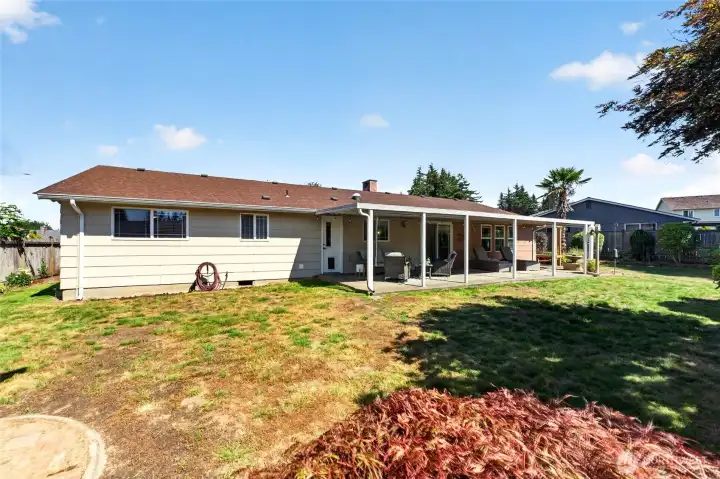 The yard features a rare palm tree and there are 2 Asian pear trees. The front and back yard also offer a sprinkler system for easy maintenance