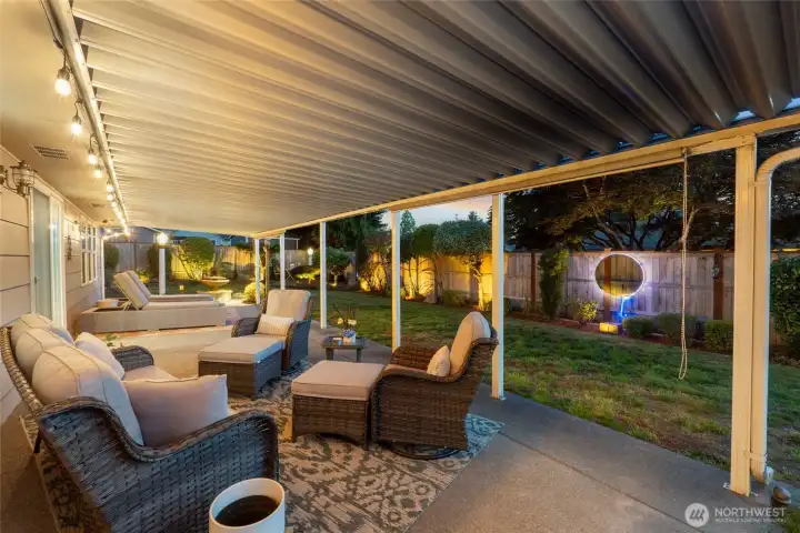 Gorgeous up-lighting accents the lush landscape and invites you to relax under the stars