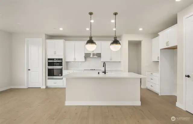 Elegant Kitchen features a large island and lots of space for cooking and living