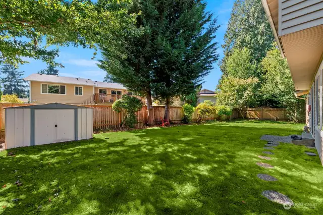 Spacious back yard with utility shed.