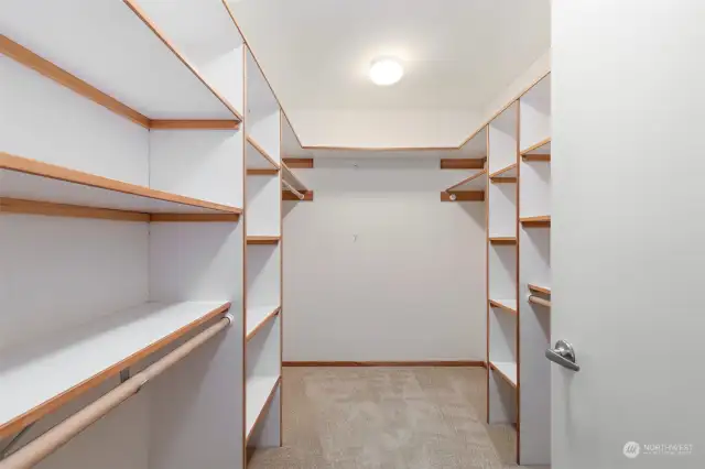 Walk in closet in the primary bedroom.