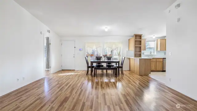 Front door with primary suite to the left and kitchen to the right.