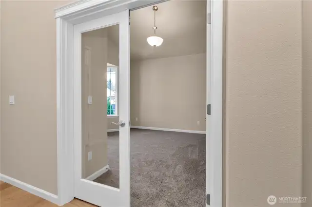 Glass french doors leading to 3rd bed/flex room. Photo from a similar plan on different lot for reference only