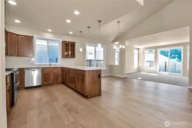 Looking over Kitchen towards dining and living rooms. Photo from similar plan on a different lot for reference only