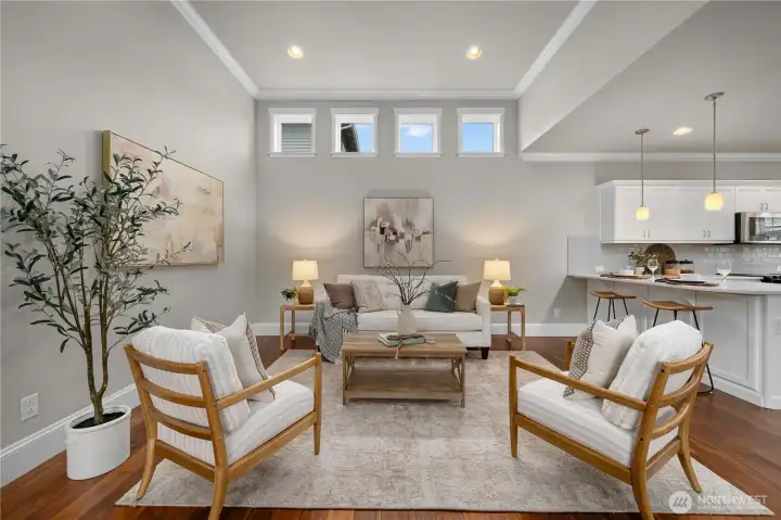 The great room offers vaulted ceilings, crown molding and lots of natural light.