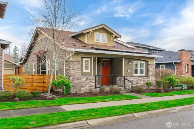 Charming street appeal with extensive stonework and a welcoming front porch greet you. A rare, oversized yard and solar panels.