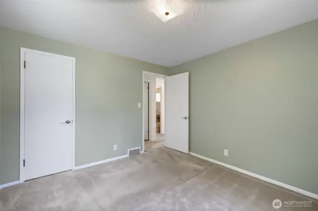 Main floor front bedroom/office, entry and closet door