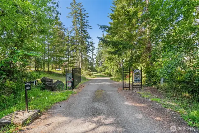 Gated entrance to Brisco Point, South Harstine Island's premier waterfront neighborhood.