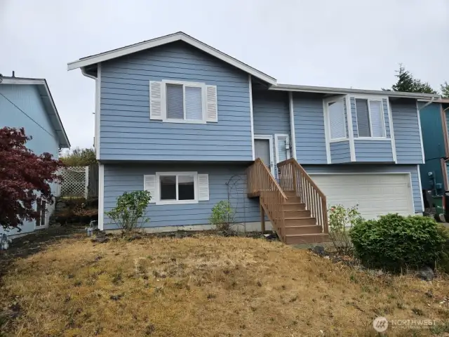 New on the market and ready for the new owner to move in! recently painted inside and out, literally minutes to everything yet set up high above the bay with territorial views. The large 2 car garage has room for a shop area and seller is leaving the work bench and built in circular saw!